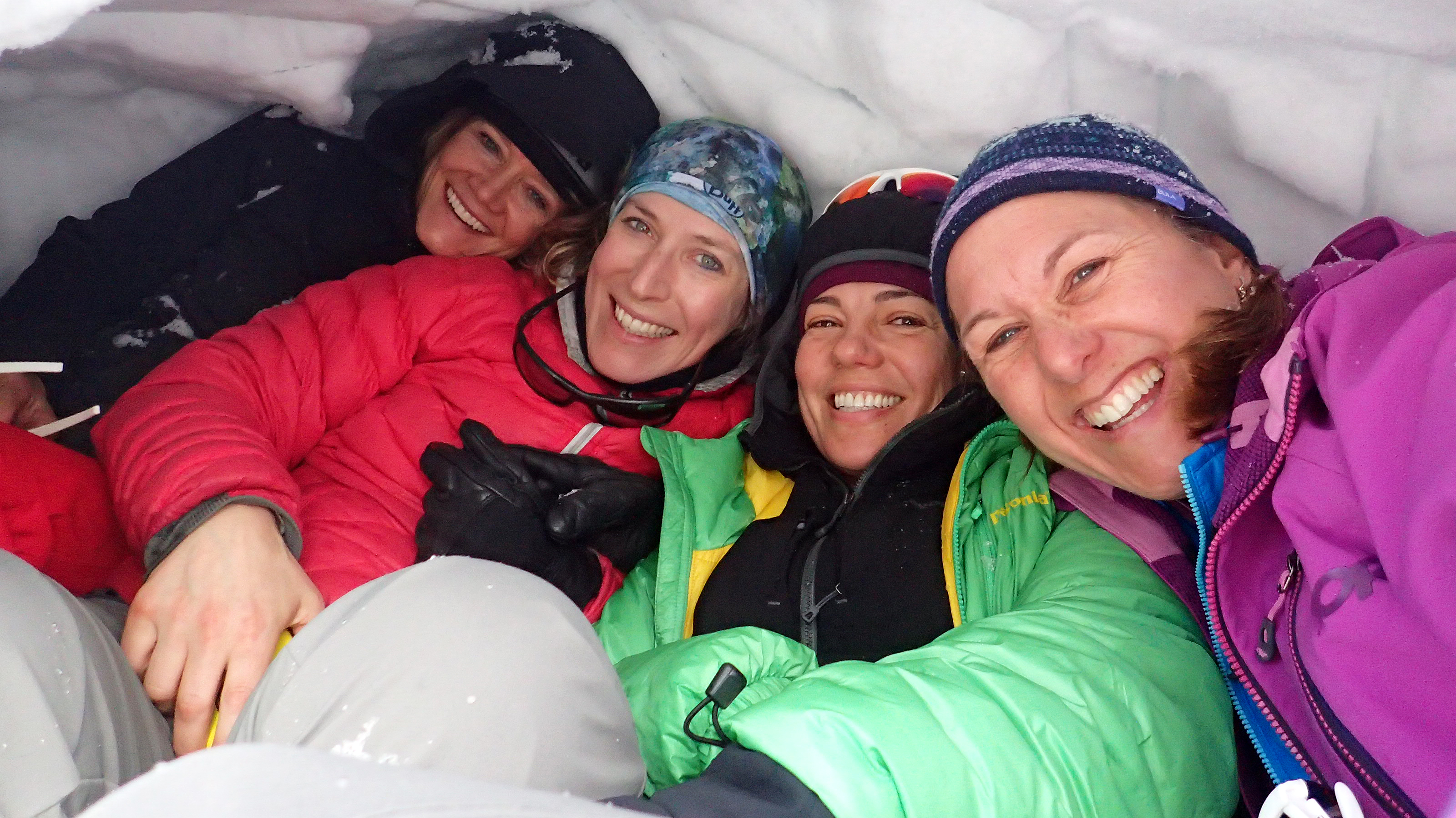 Instructor Kitty Calhoun (far left) in a snow cave in Colorado with (from left) Holly Mullally of Seattle, Heckles, and Kari Bodnarchuk.