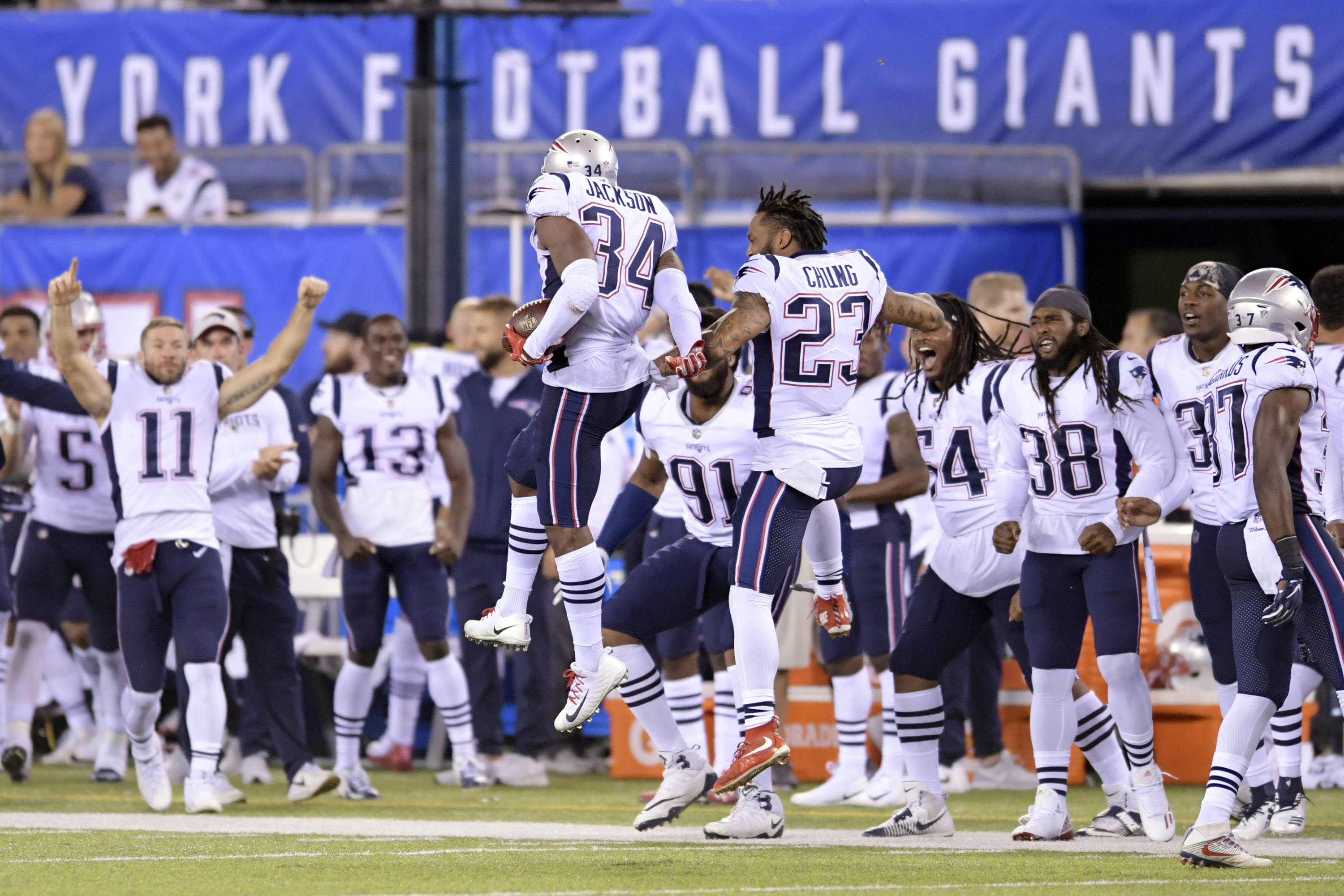 Patrick Chung celebrating with J.C. Jackson after Jackson recorded an interception against the Giants in the preseason.