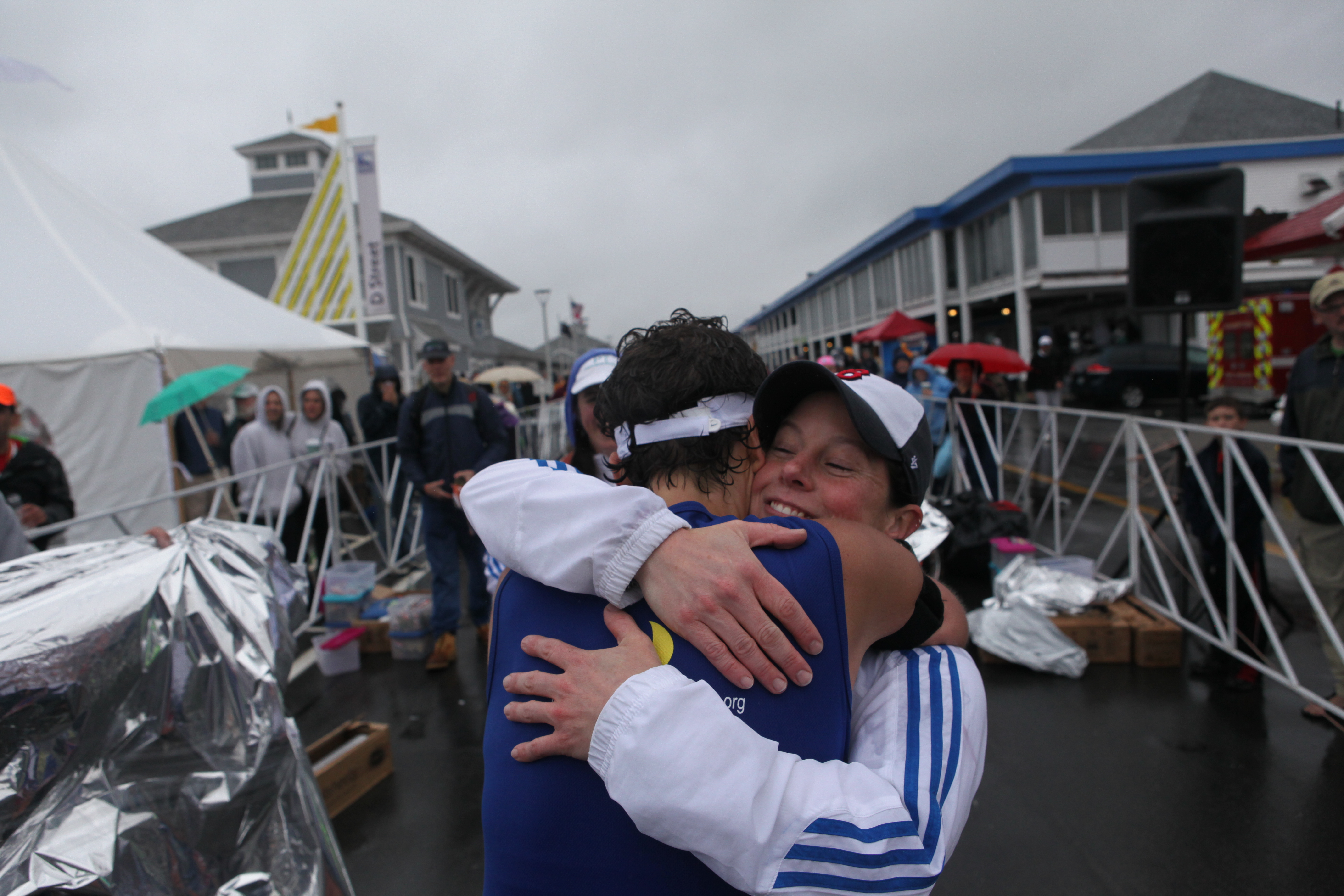 Nicole Fluet McGerald (right) assisted at a race in Hampton, N.H., Oct. 6 in which colleague Amanda McCann ran.