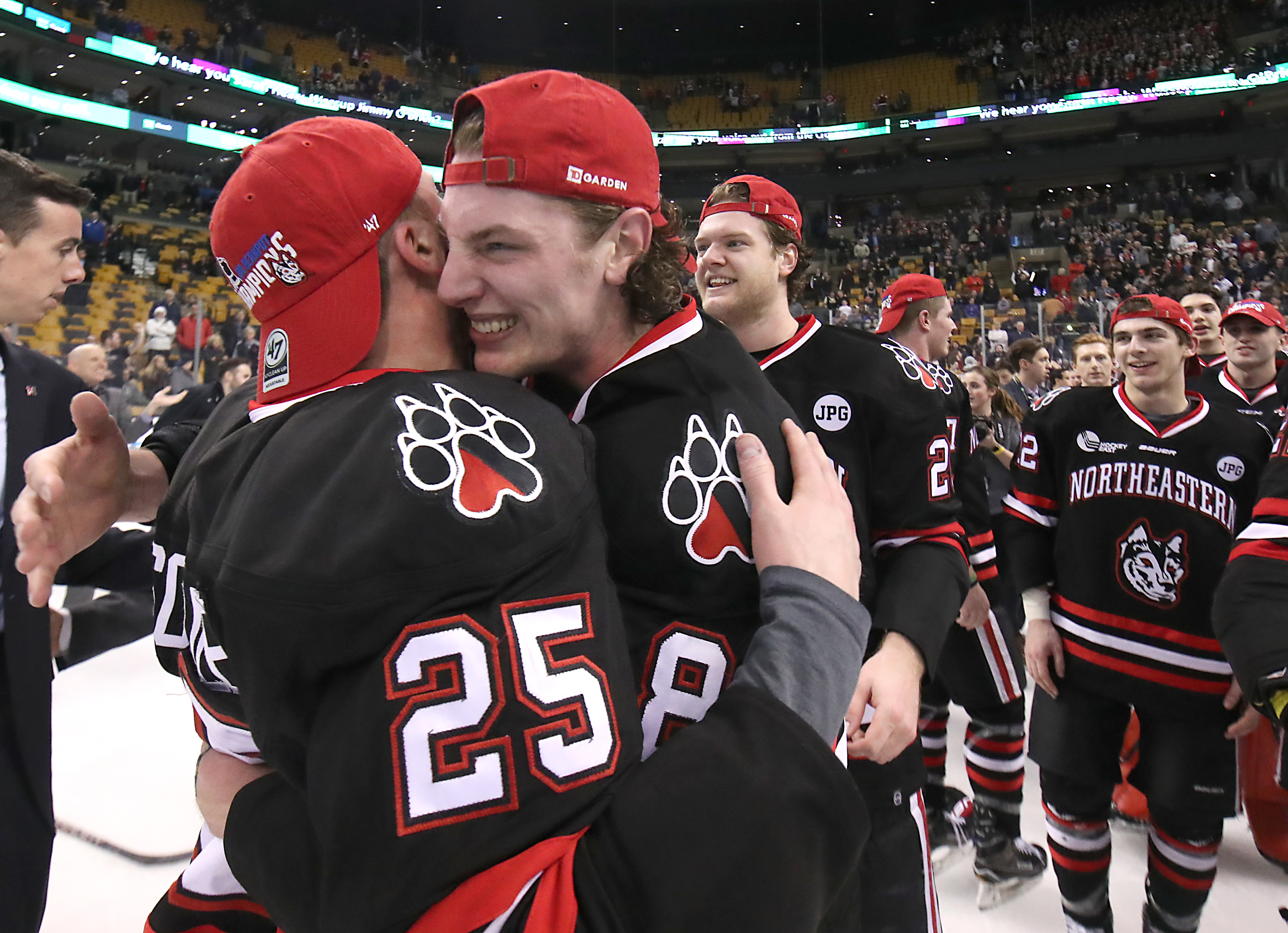 Northeastern Adam Gaudette hugged teammate Patrick Schule after the game.