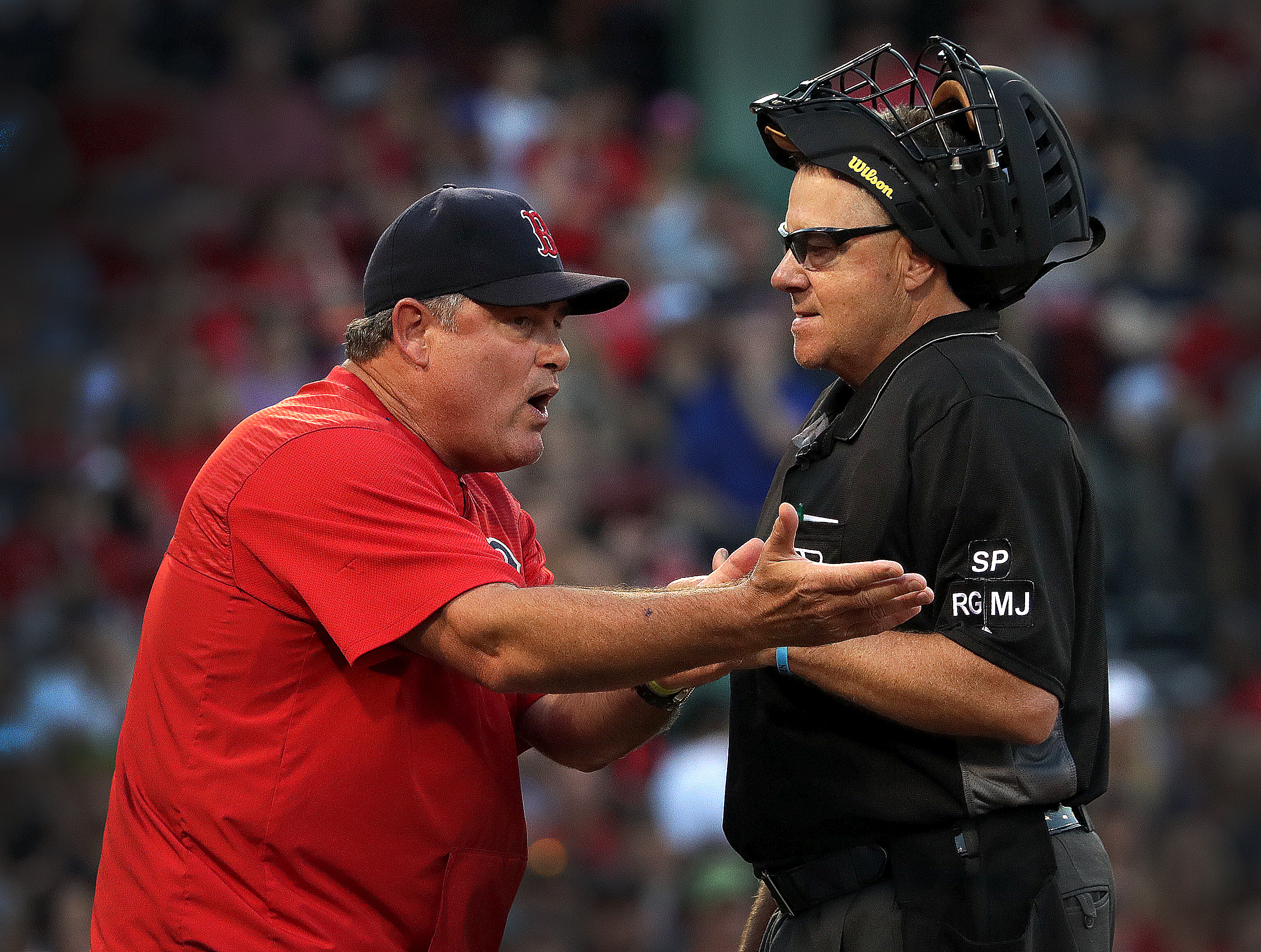 Red Sox manager John Farrell (left) argues a play during the 11th inning of the Yankees game July 15.