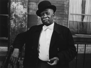 “A Man in a Bowler Hat’’ by photographer Dawoud Bey.