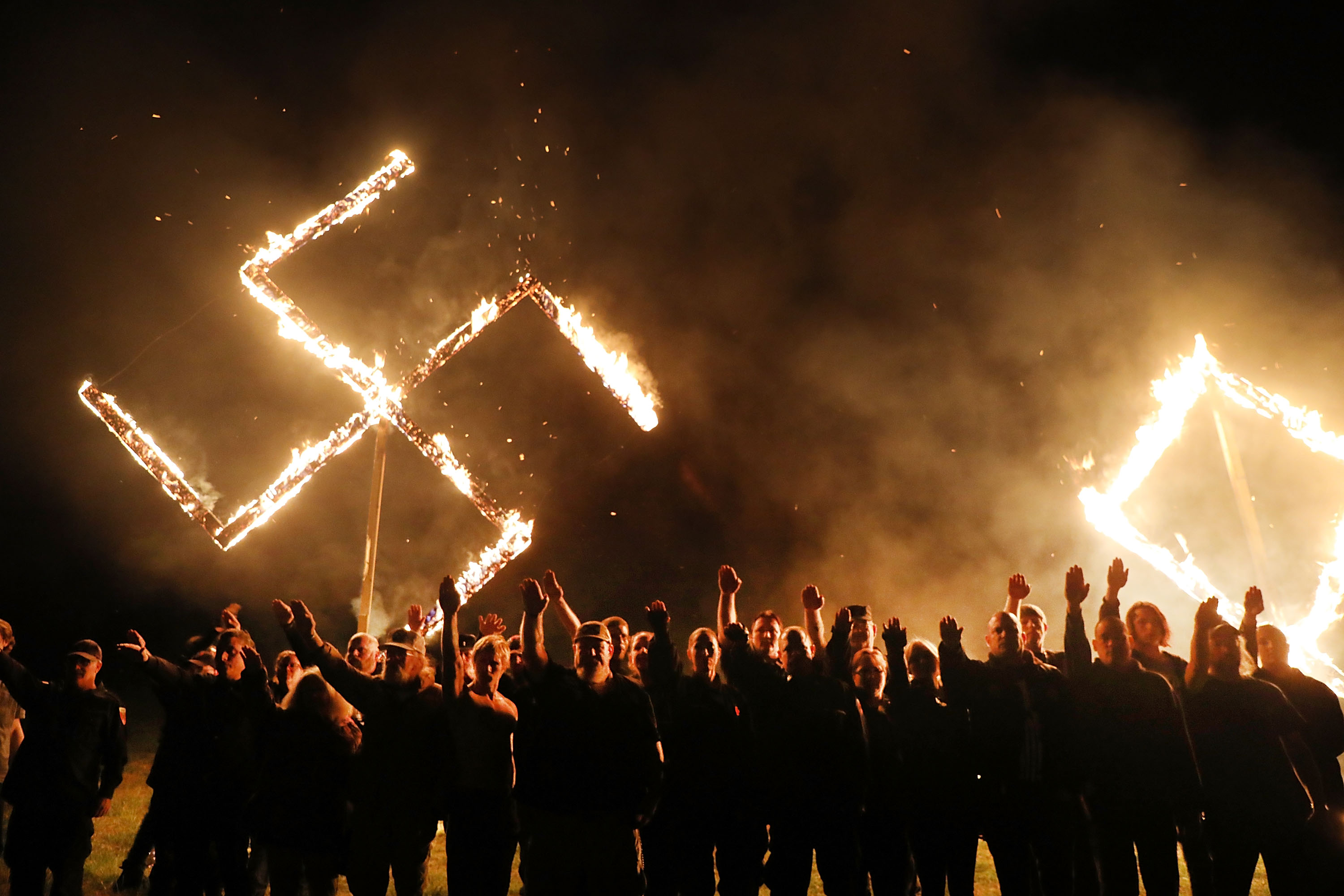 Members of the National Socialist Movement held a swastika burning Saturday in Draketown, Ga.