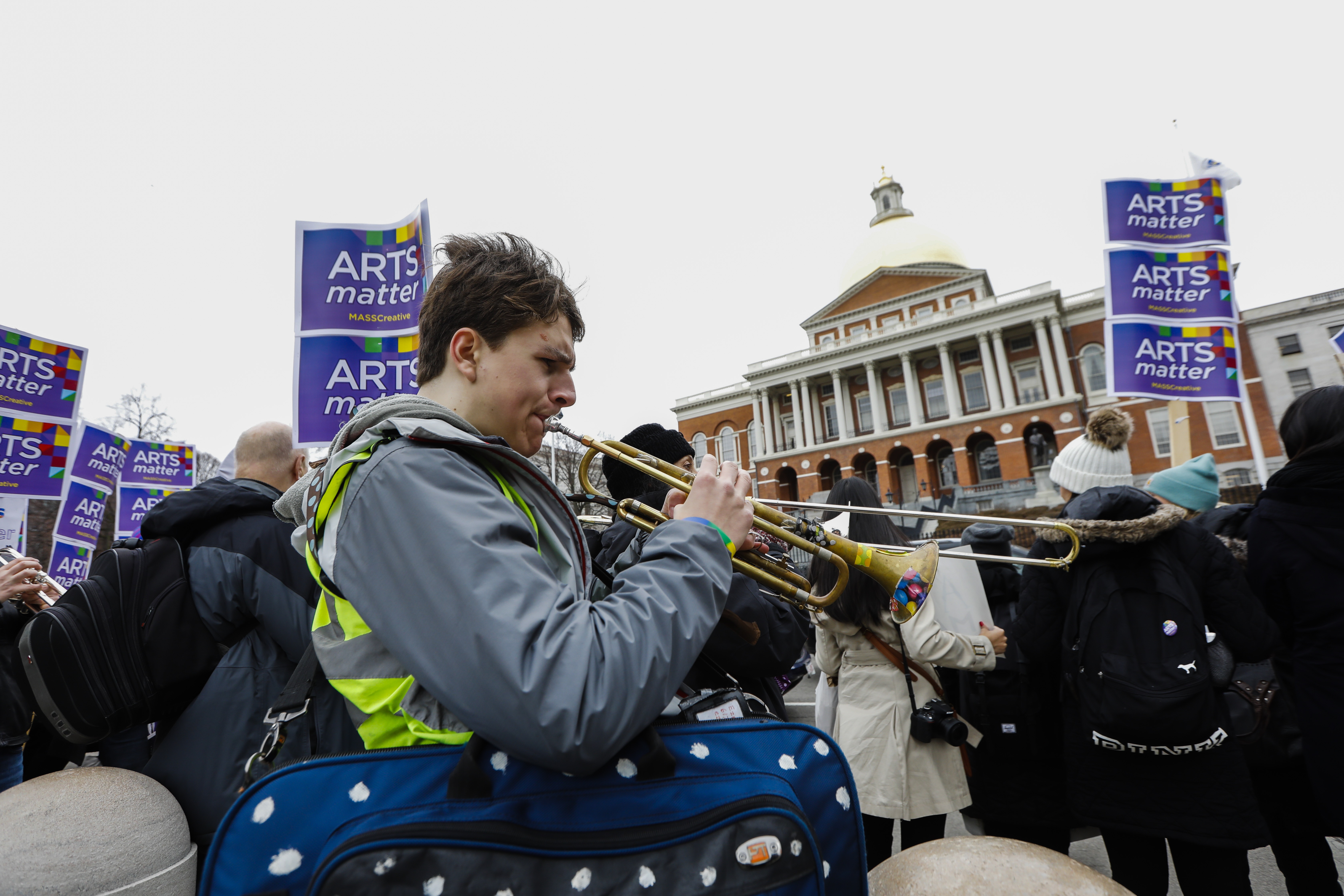 Musicians played their instruments across the street from the State House on Arts Matter Advocacy Day.
