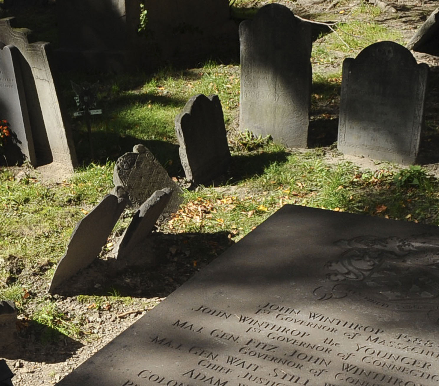 Author Sarah Vowell poses next to Gov. John Winthrop's tomb, right, at King's Chapel in Boston, Friday, Oct. 10, 2008. Her new book, "Wordy Shipmates," portrays the early Puritans who were led by Winthrop. (AP Photo/Lisa Poole)