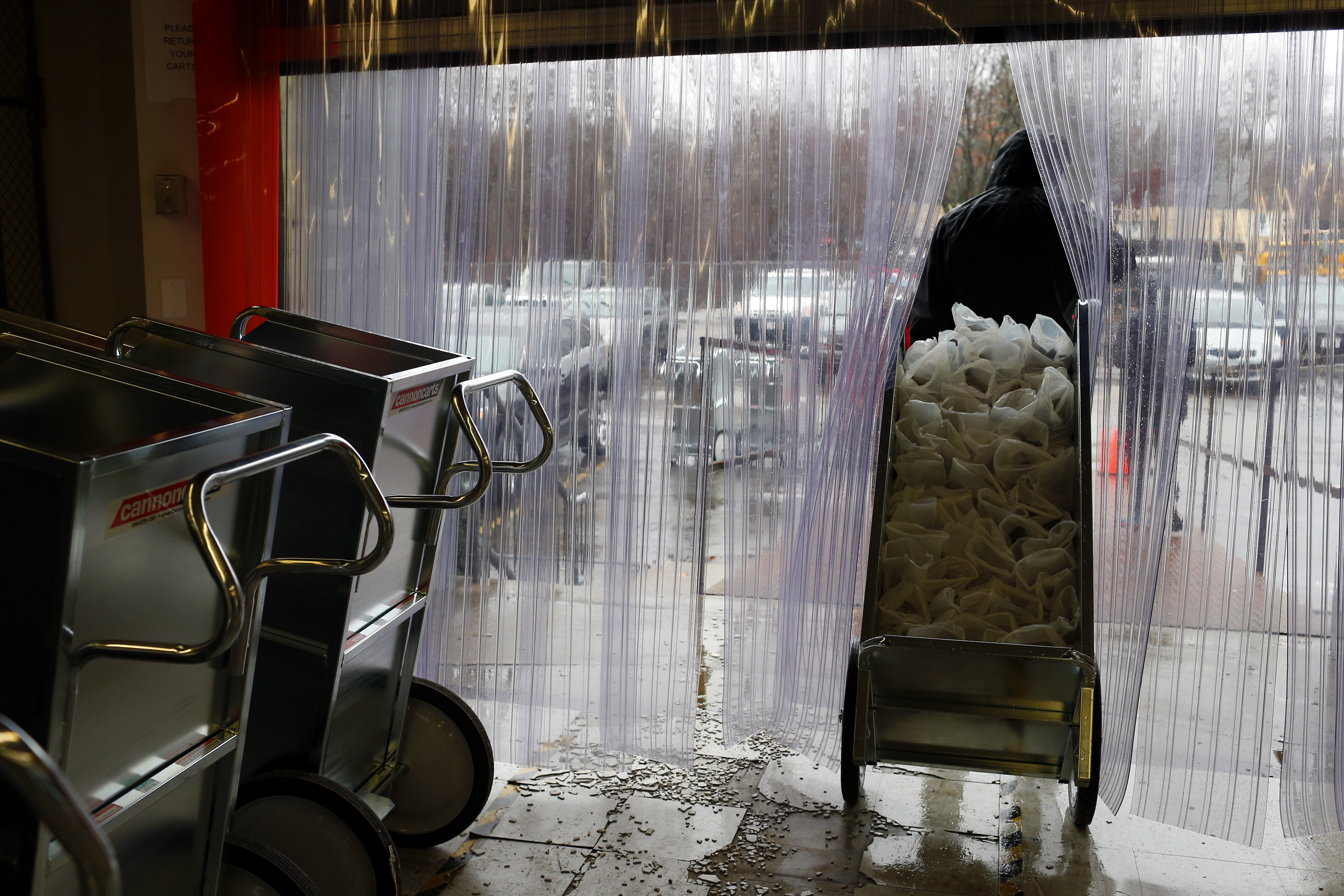 A cart full of Sunday Boston Globe newspapers was walked out of a Newton distribution center earlier this month.