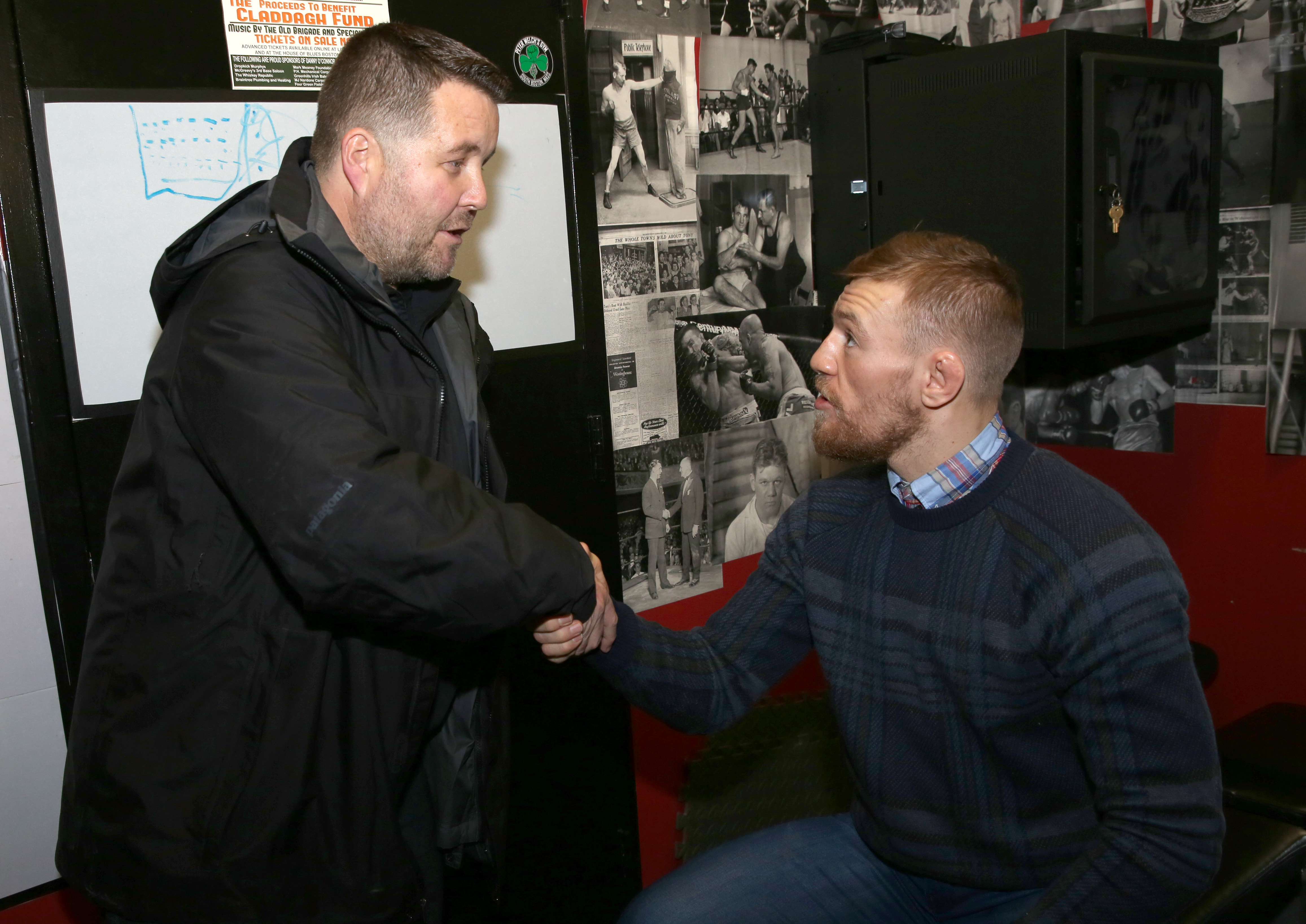Conor McGregor greets Ken Casey (left).