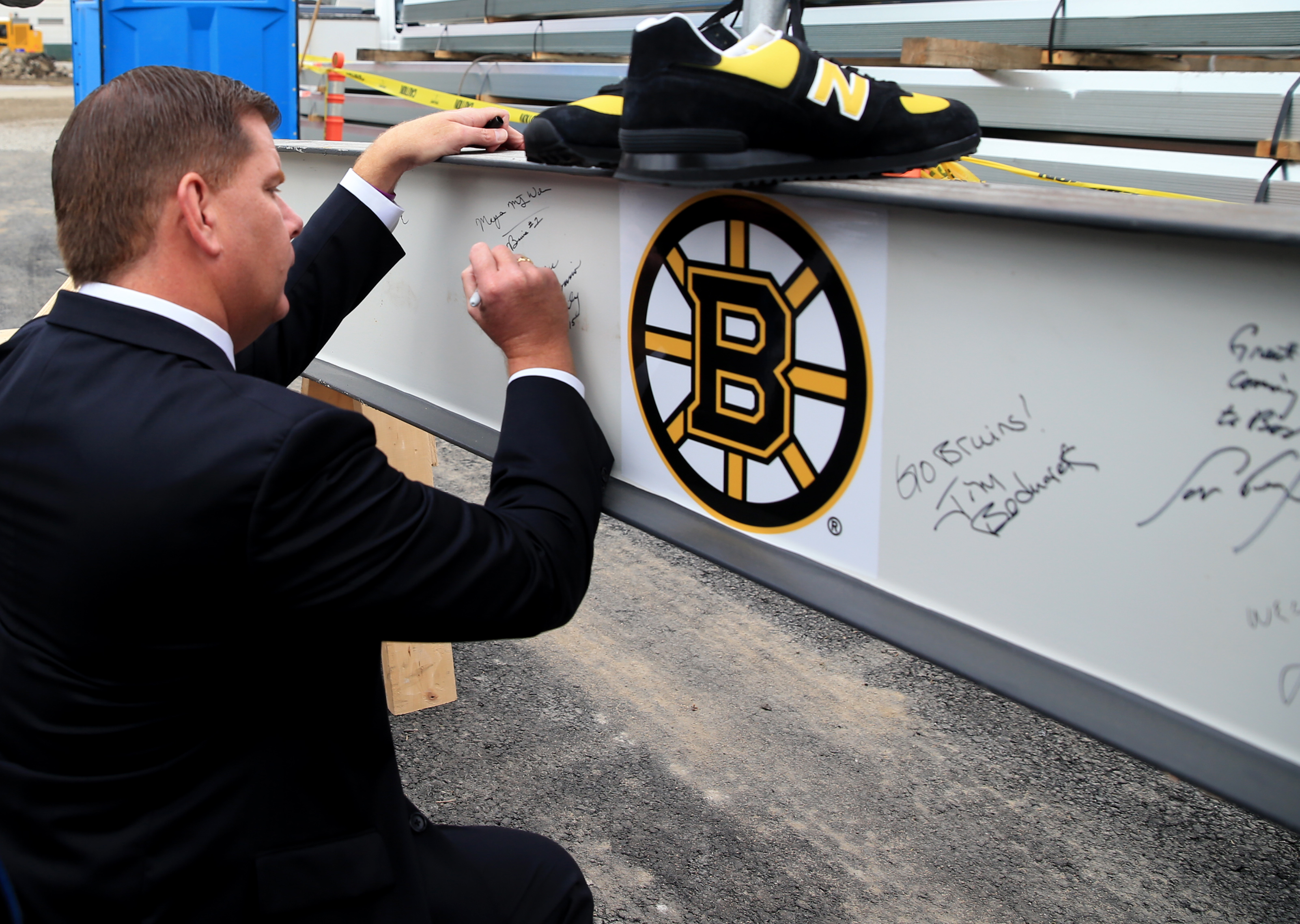 Mayor Martin J. Walsh signed one of the steel beams at the topping-off ceremony for the Warrior Ice Arena at Boston Landing.