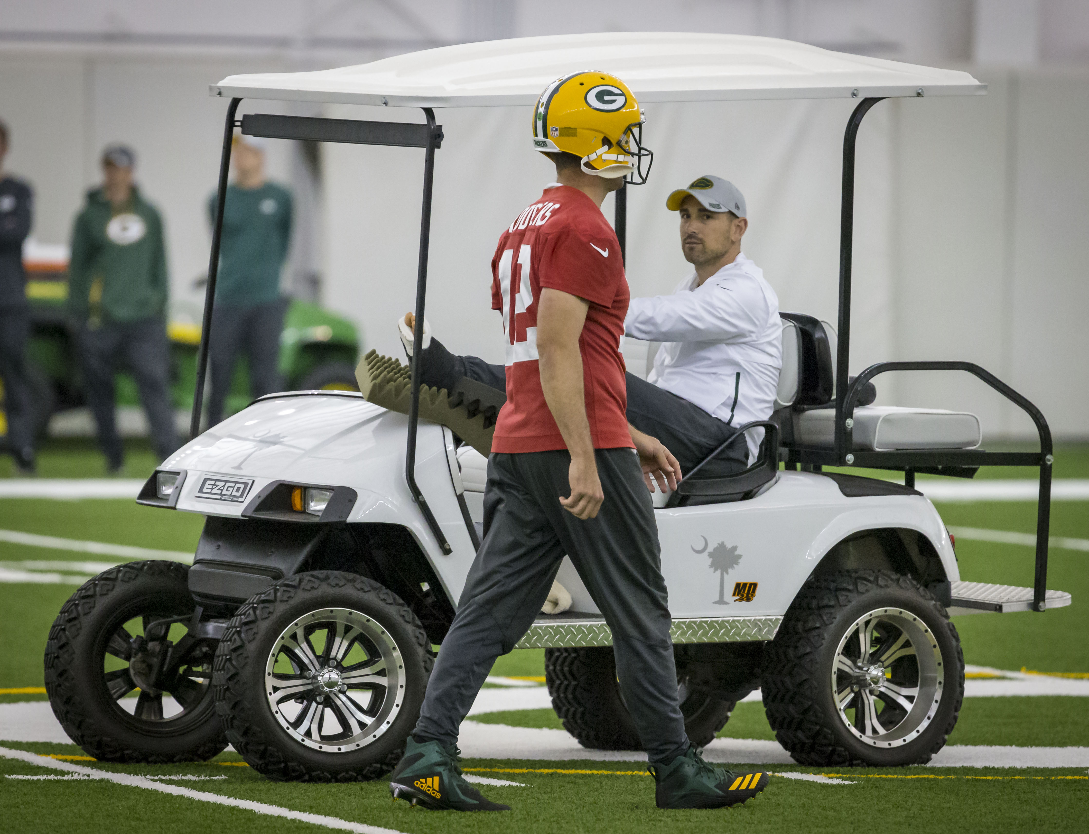 Packers quarterback Aaron Rodgers walked past coach Mike LaFleur during a practice.