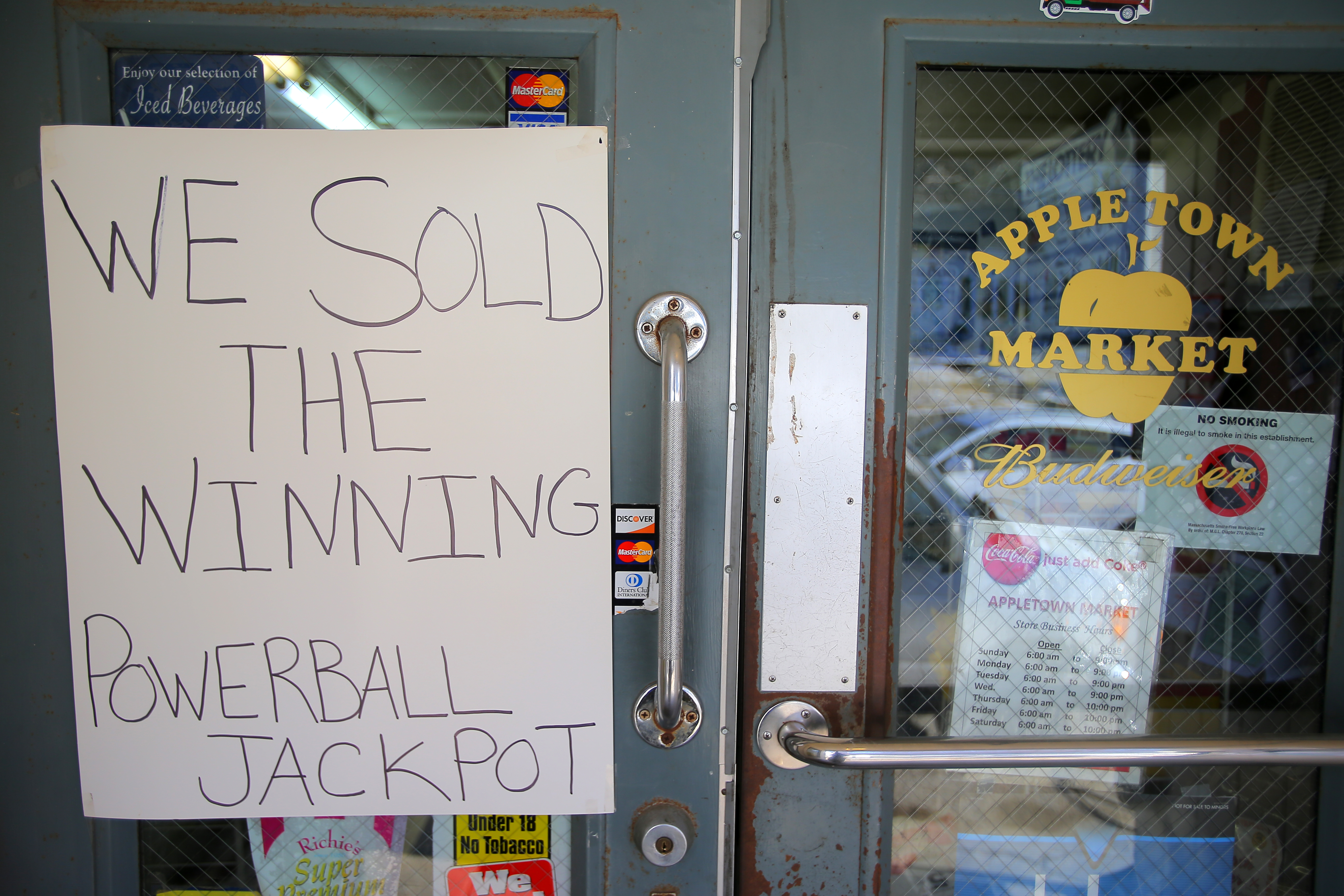 A sign hung on the front door of the market boasted of having sold the jackpot-winning ticket. But no one knows the name of the winner.