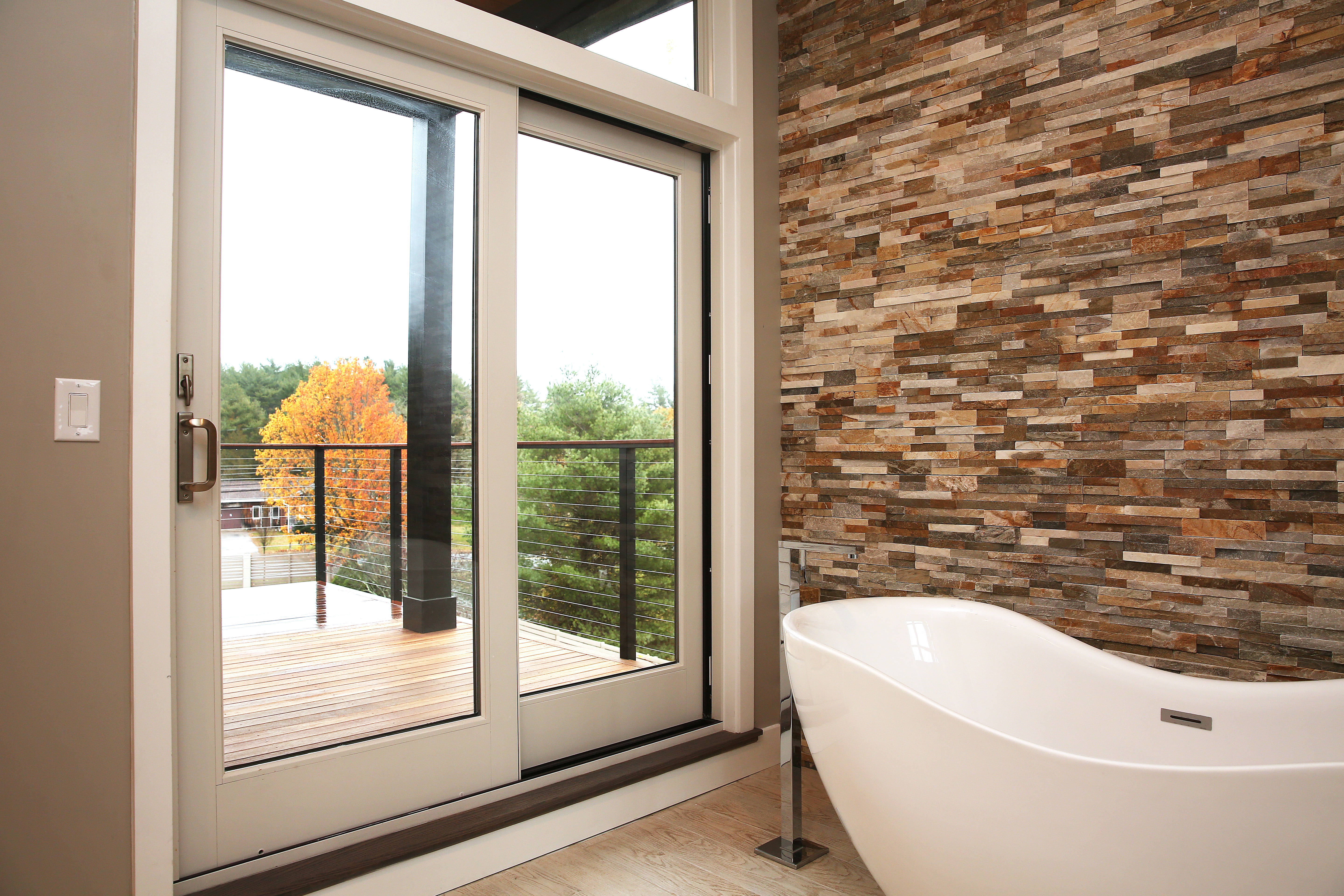 The master bath with soaking tub and deck access.