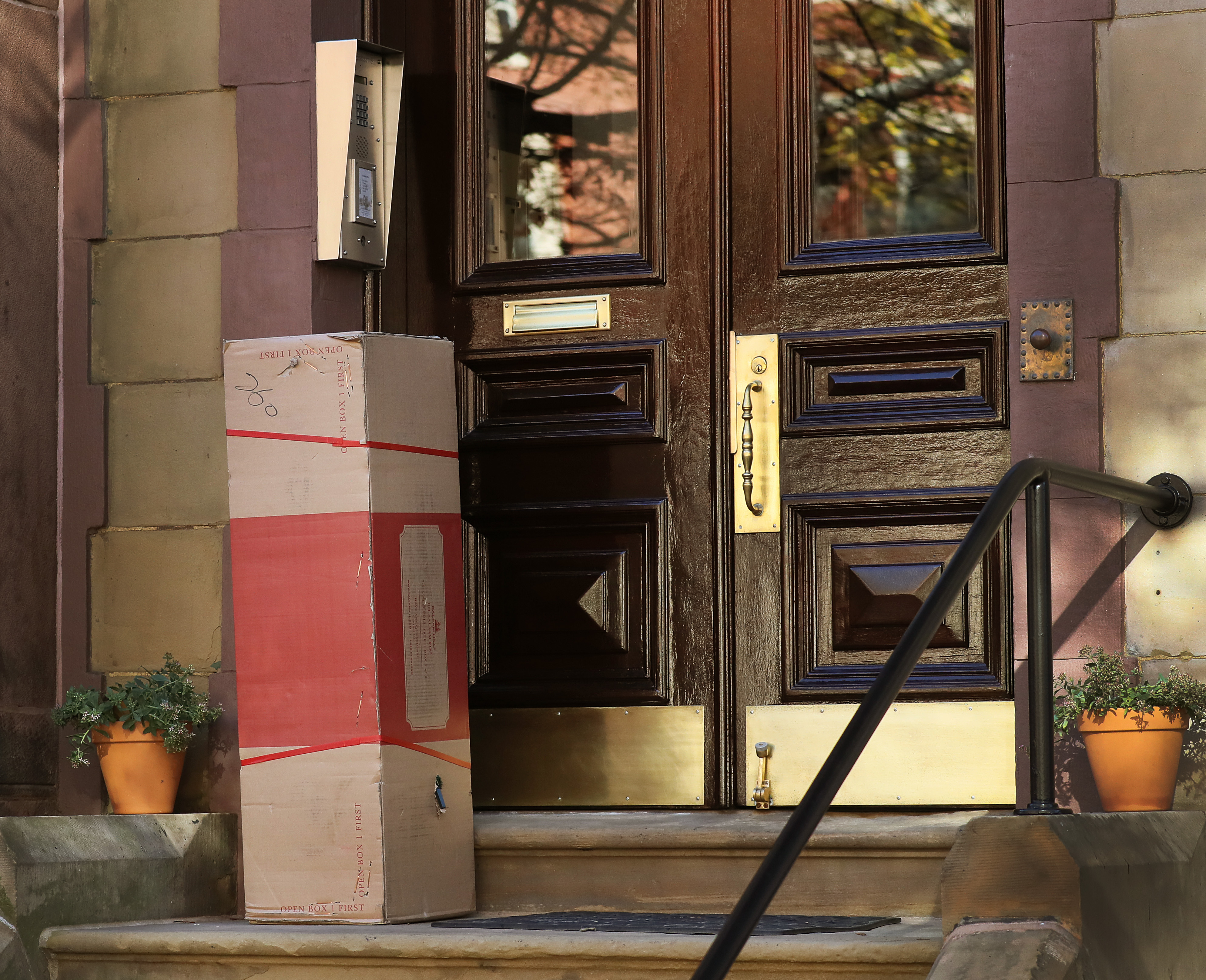 A package on the steps of a home on Beacon Street.