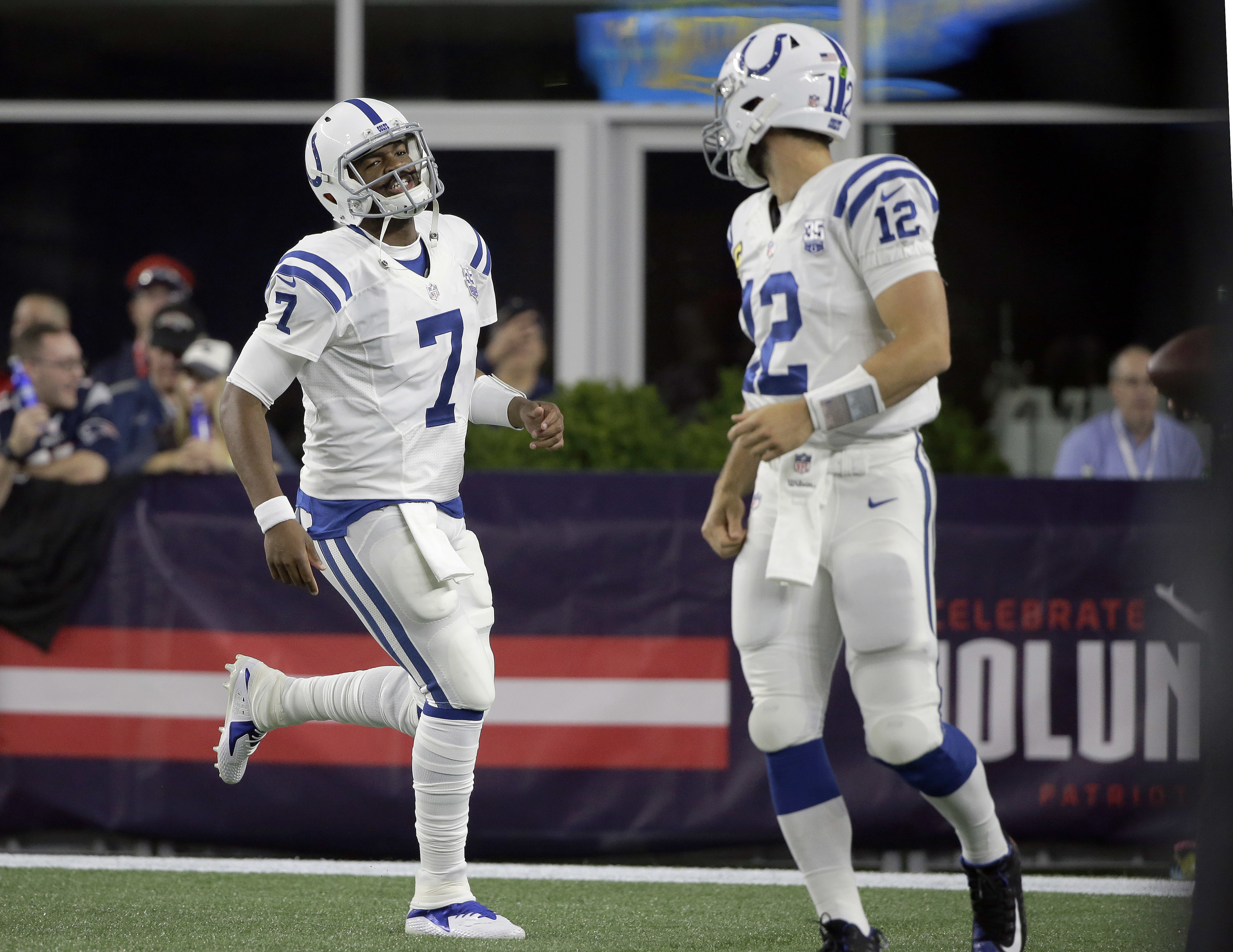 Former Patriots quarterback Jacoby Brissett and Andrew Luck.