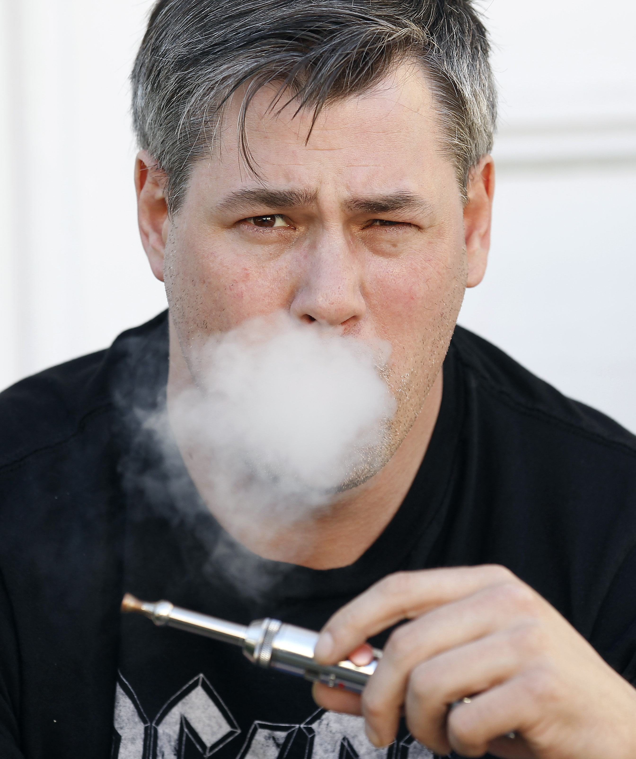 James Donessoni of Rhode Island can vape — use an e-cigarette — at his desk, but that’s not the rule in all companies.