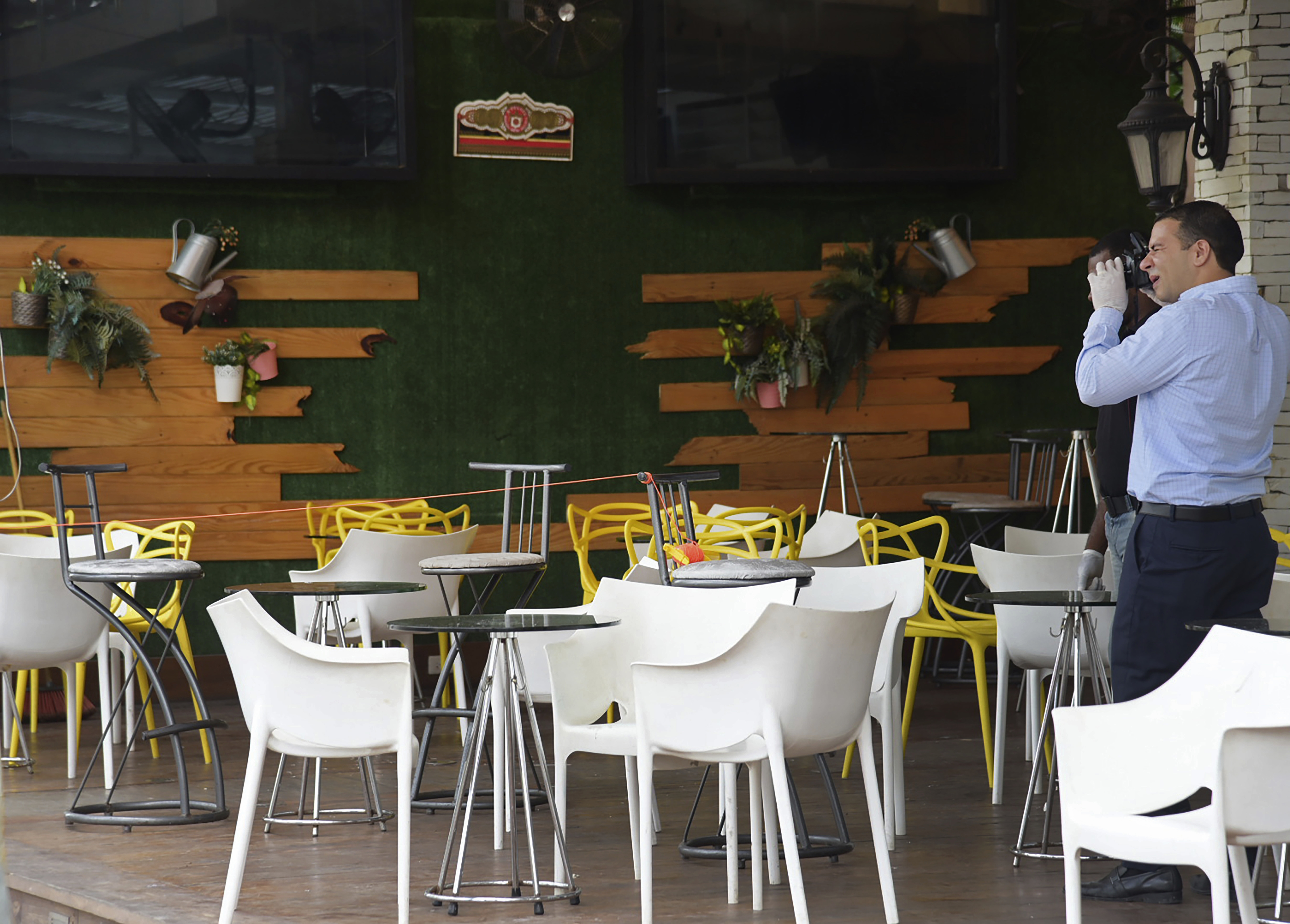 Investigative police collected evidence at the Dial Bar and Lounge in Santo Domingo, Dominican Republic.