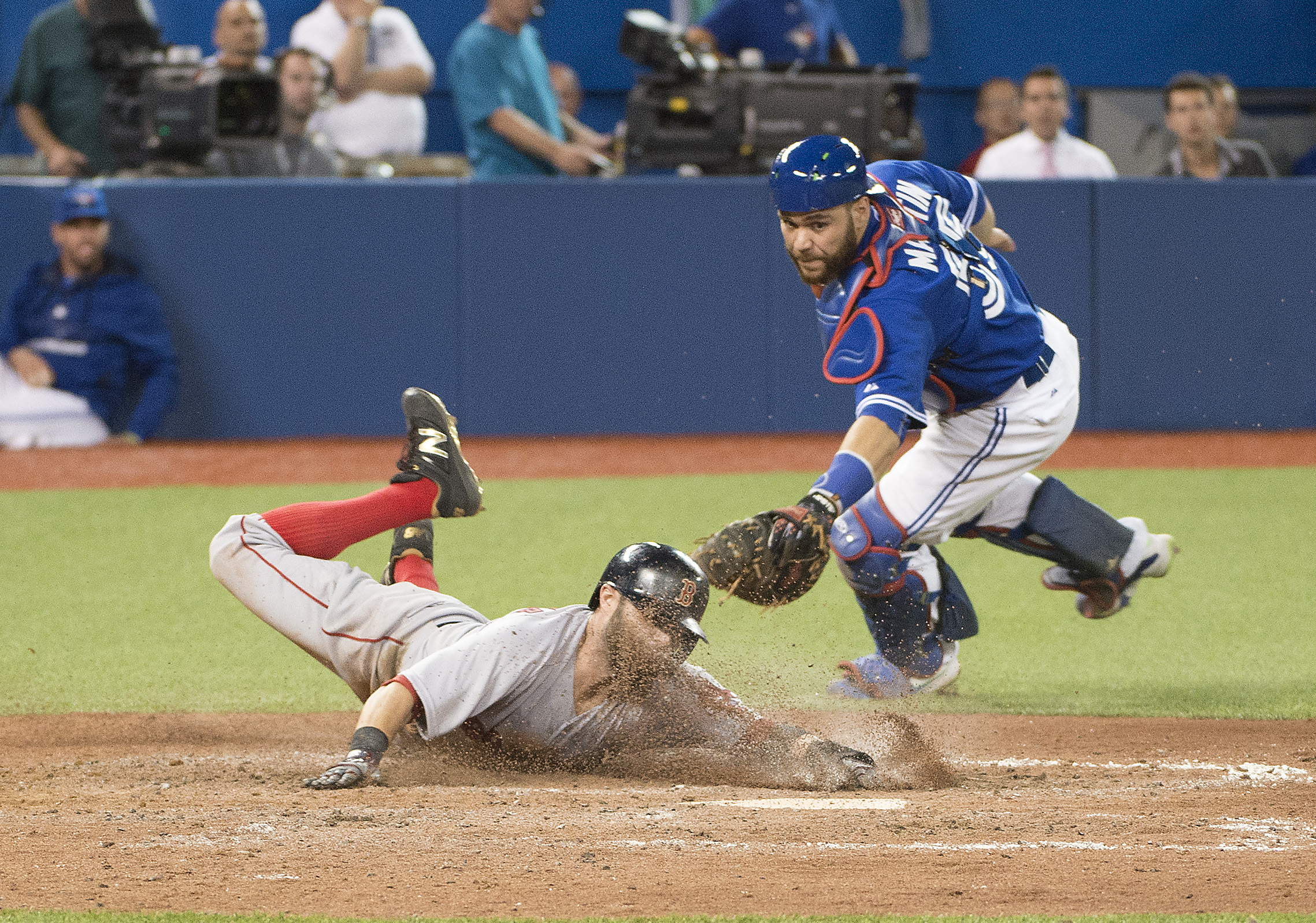 Red Sox second baseman Dustin Pedroia eluded Russell Martin’s tag to score in the ninth inning.