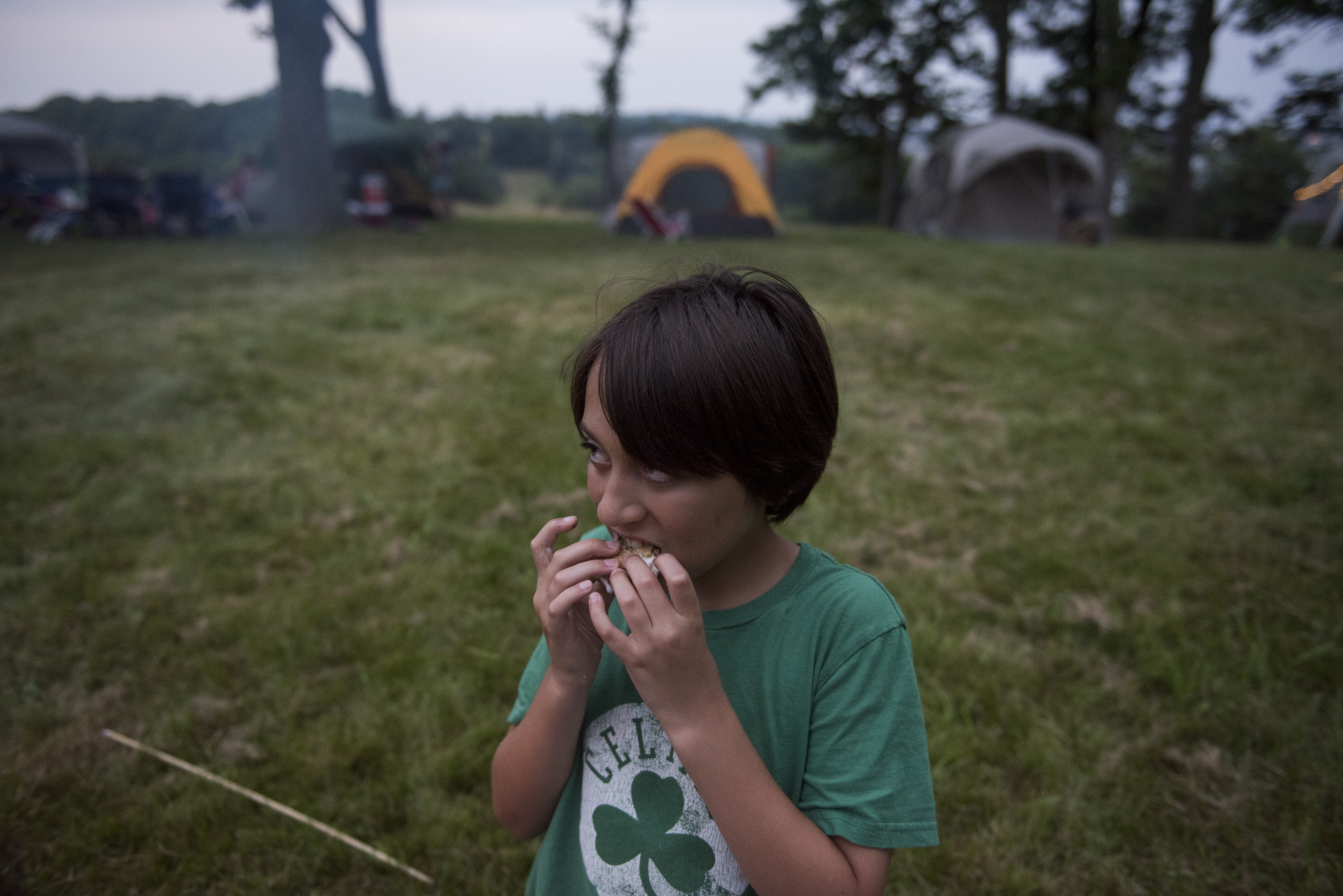 Nike Gibson, 11, eats a s’more during the annual World End's Reservation overnight camping event.