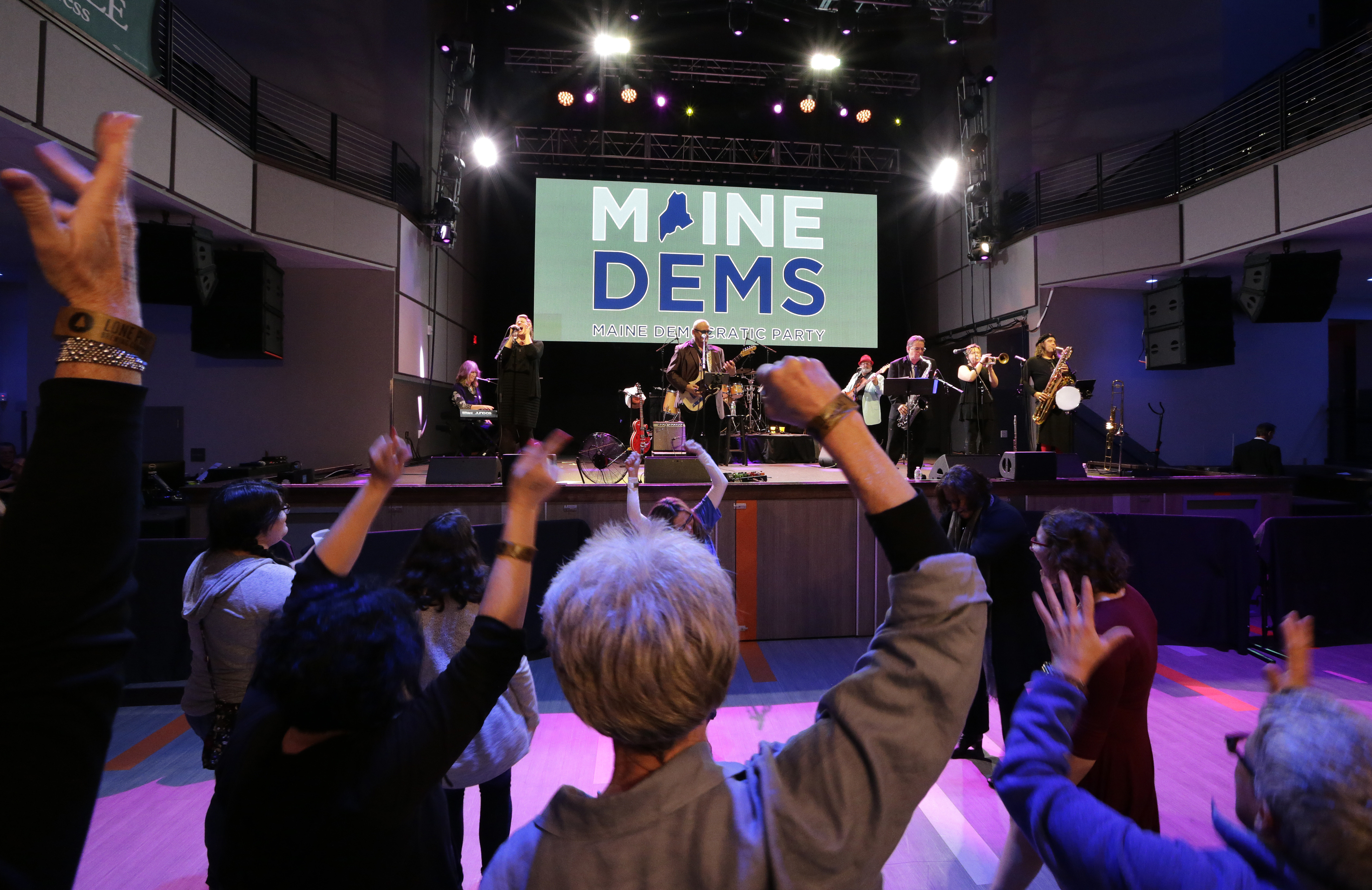 People danced at a Maine Democratic Party event on election night in Portland.