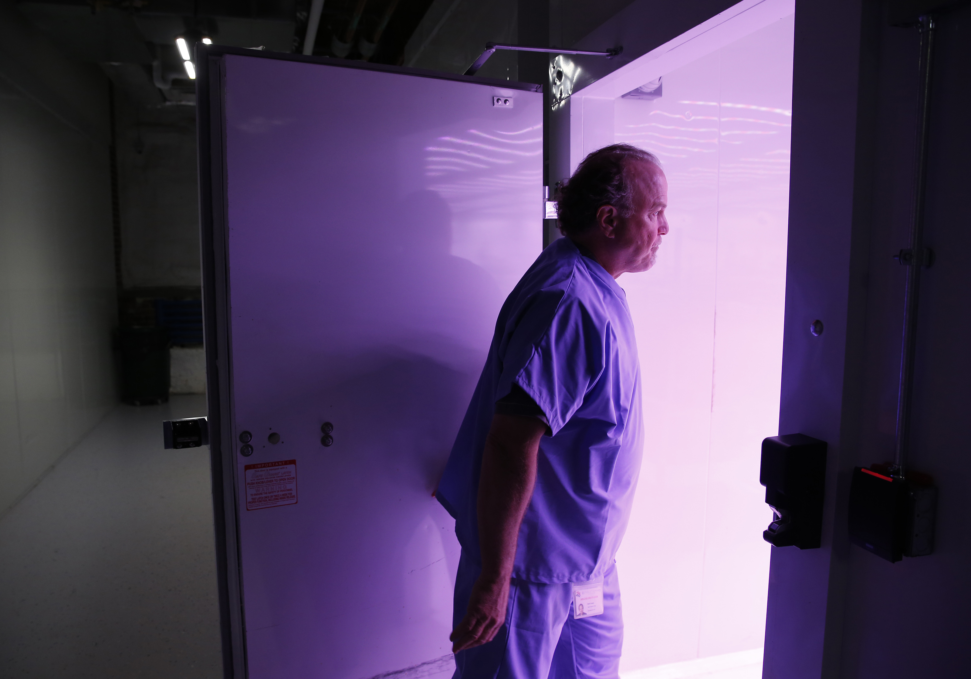 Keith Cooper, CEO of Revolutionary Clinics, opened the door to a flowering room inside Revolutionary Clinics marijuana cultivation facility.