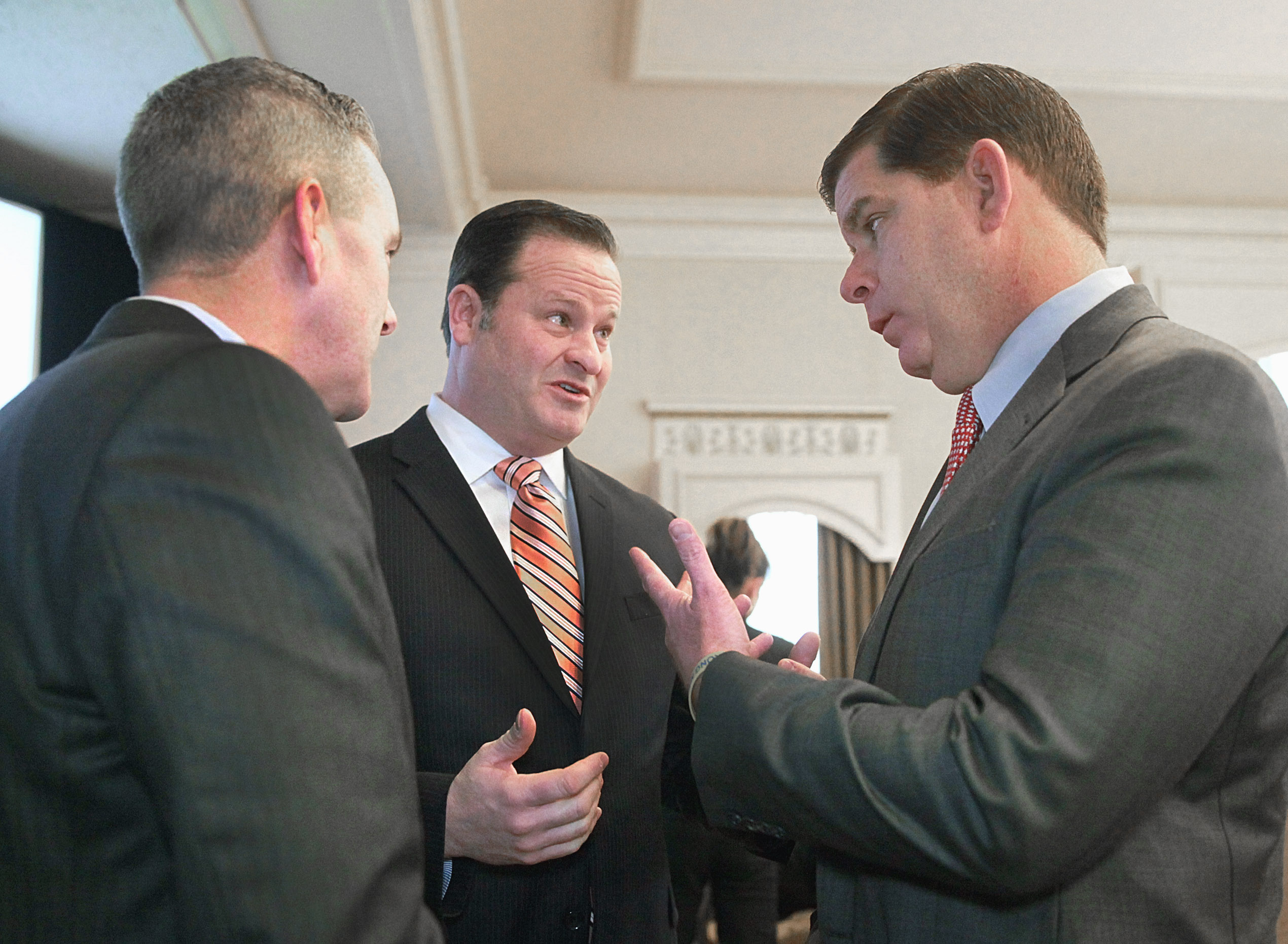 Robert Coughlin (center) of MassBio is a former state representative who also briefly worked in the Patrick administration.