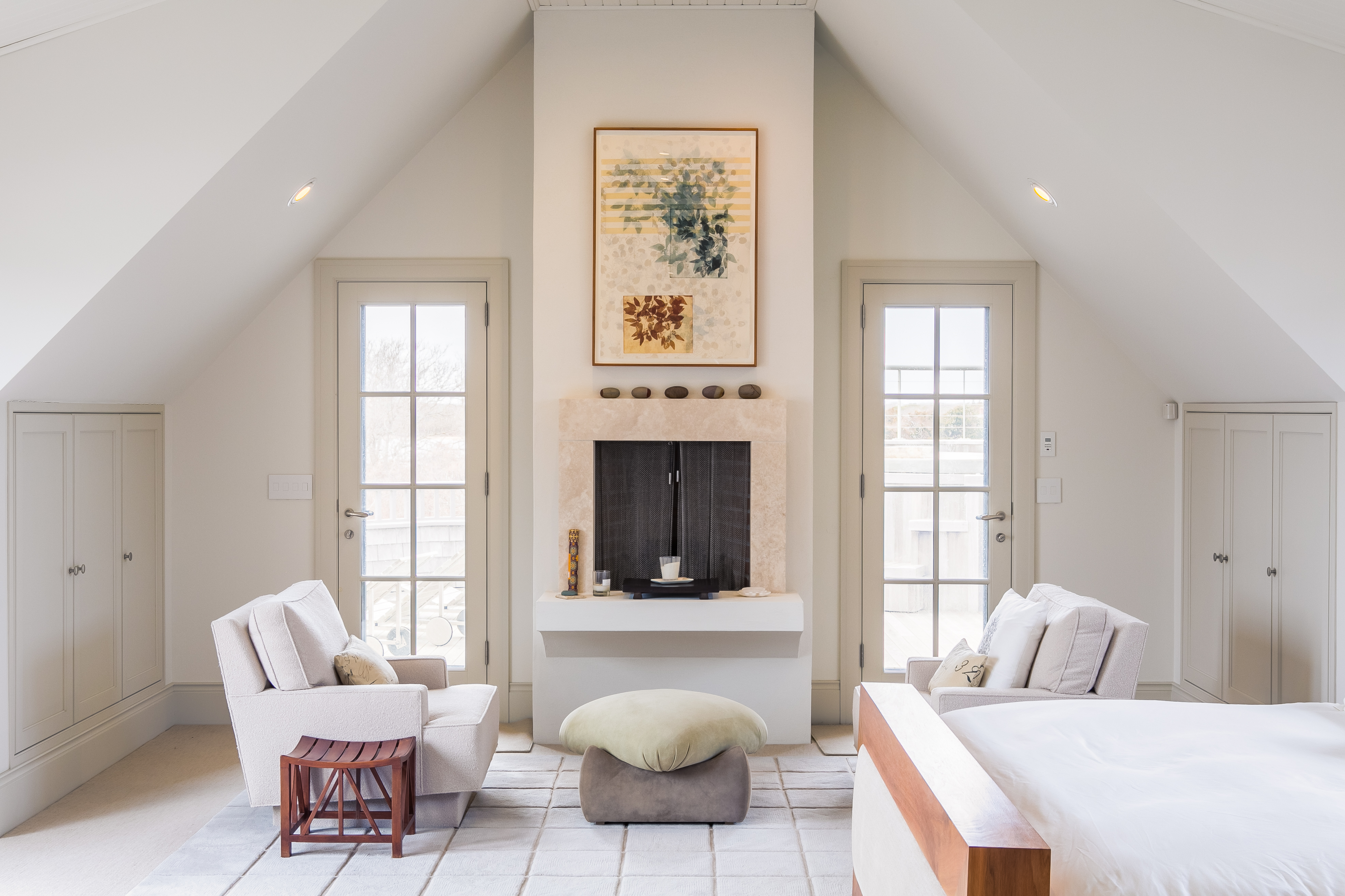 A closer look at the fireplace and sitting area in the master bedroom.