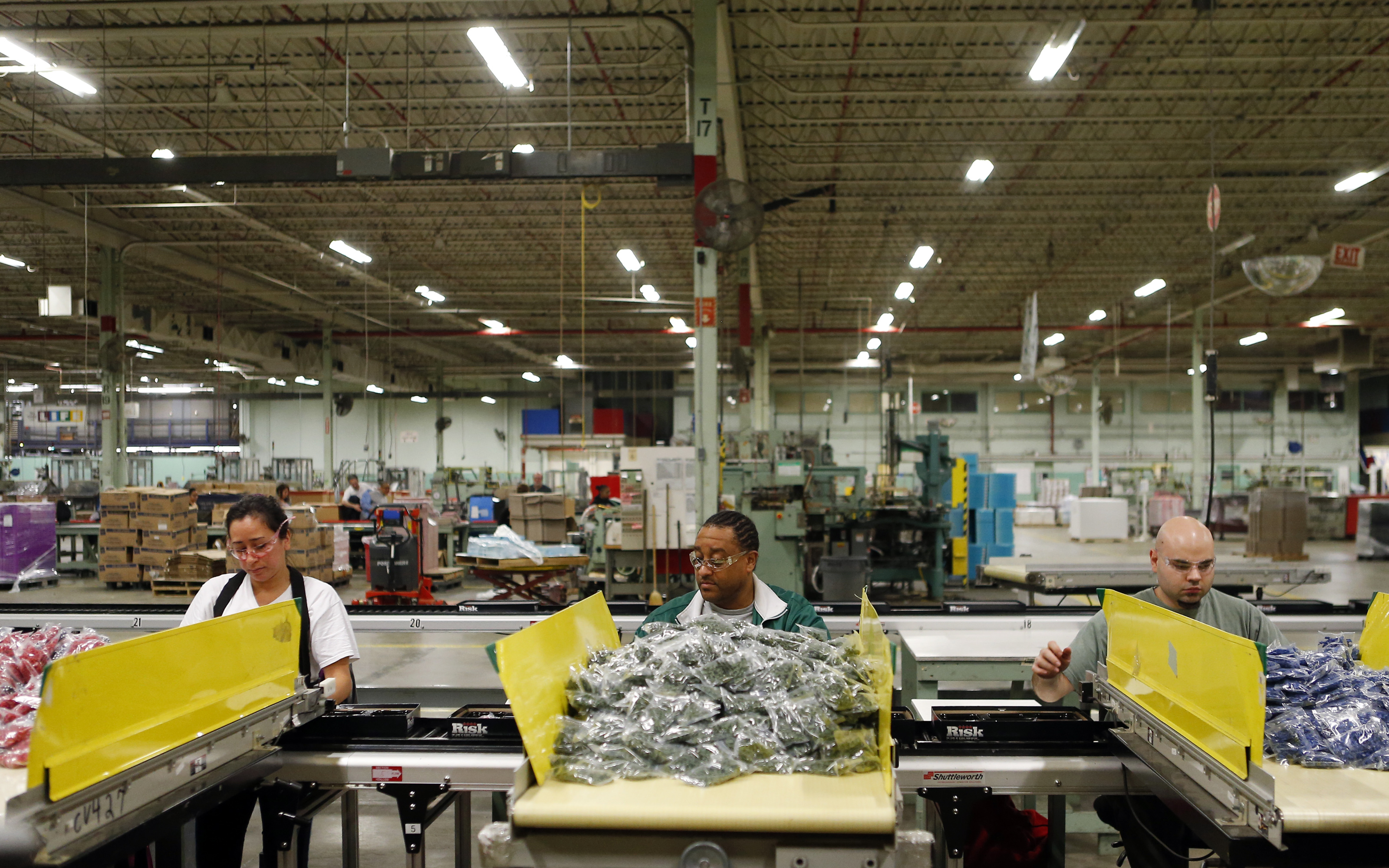 At Hasbro’s plant in East Longmeadow, workers assemble games like Risk.