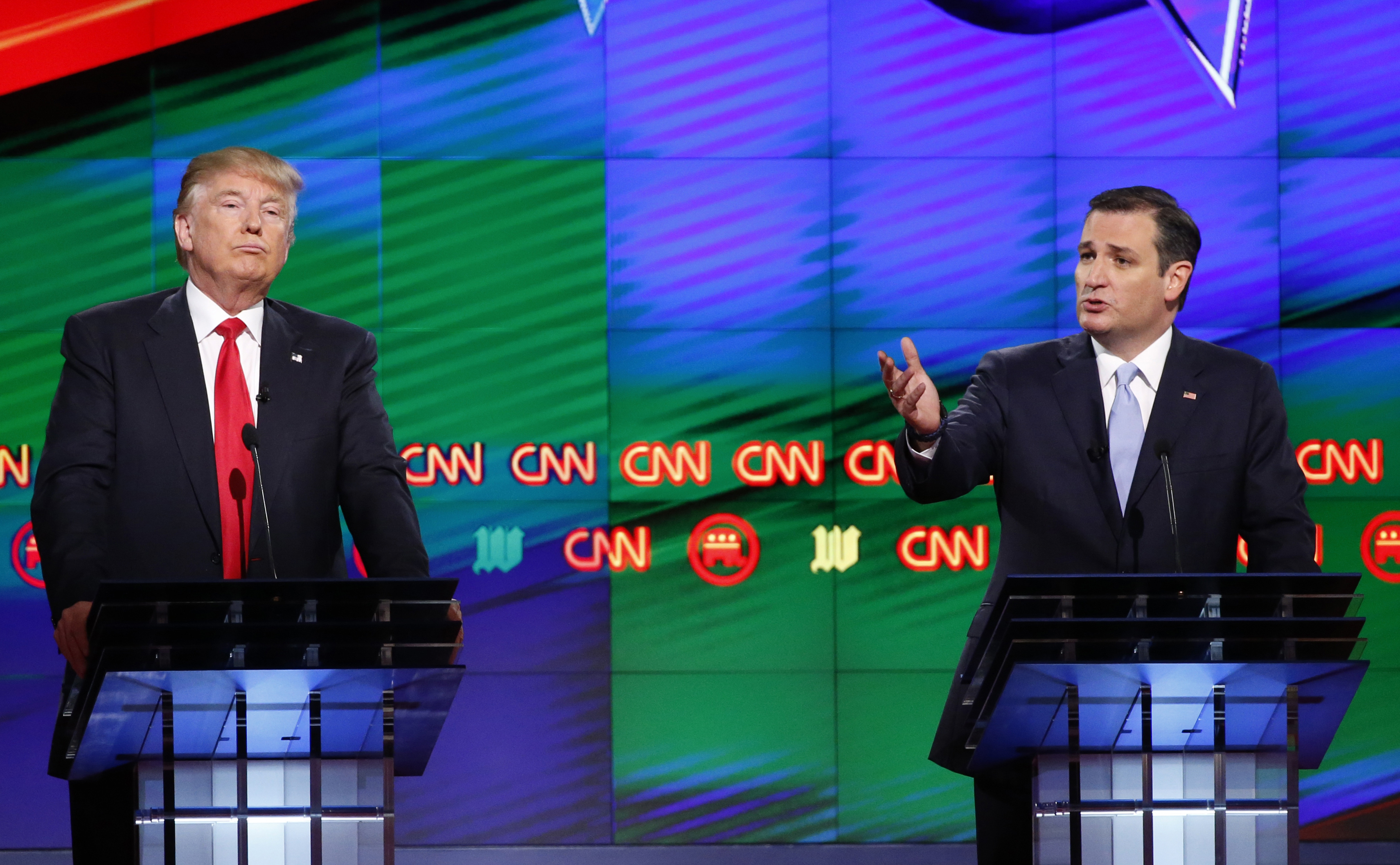 Then-Republican presidential candidate, Senator Ted Cruz, R-Texas, spoke as then-Republican presidential candidate, businessman Donald Trump listened, during the Republican presidential debate sponsored by CNN.