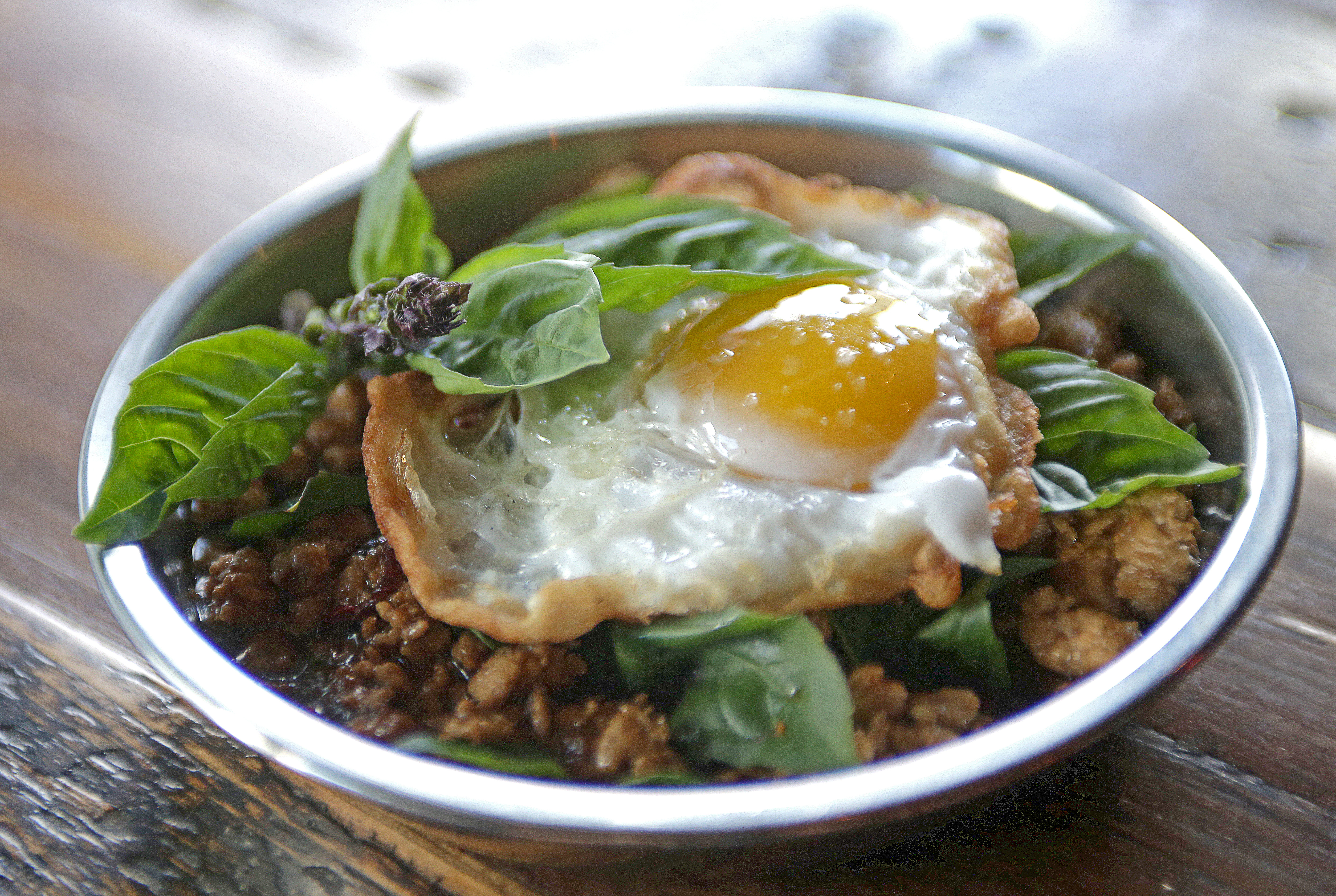 Pad gra pow, which is topped with a fried egg.