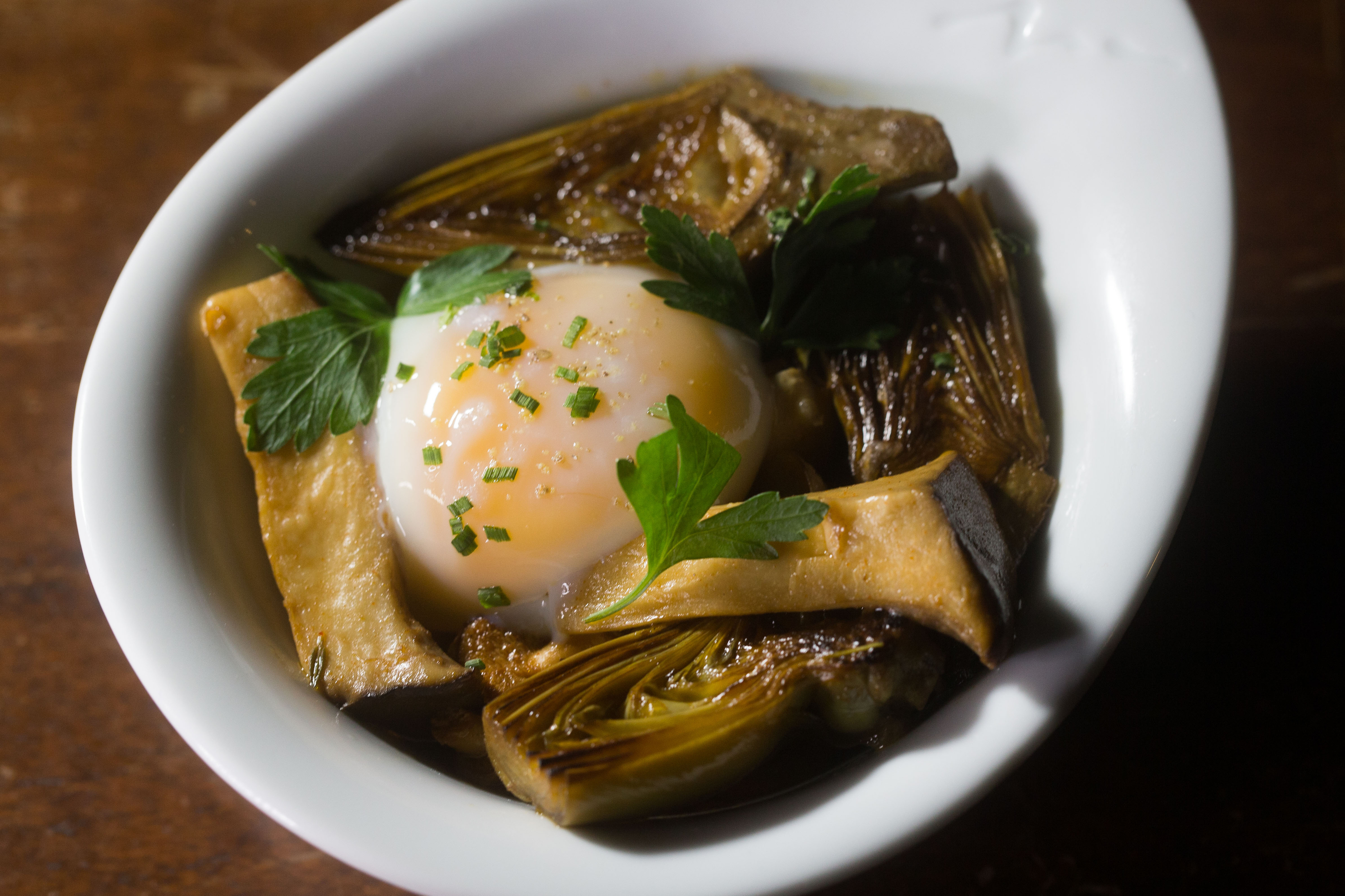 Wild mushroom in escabeche with baby artichokes and farm eggs at La Bodega in Watertown.