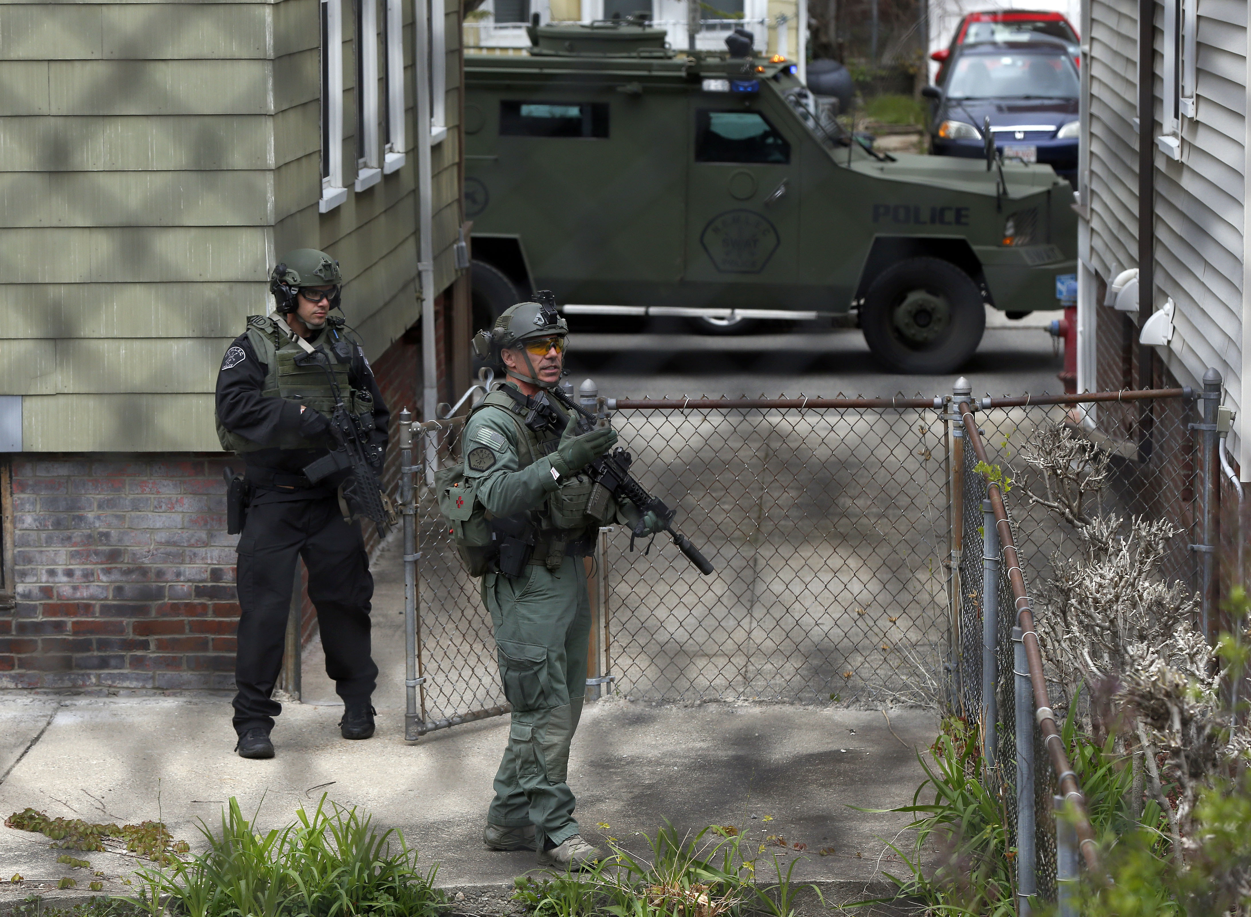 Police officers searched a backyard in the Davis Square neighborhood.