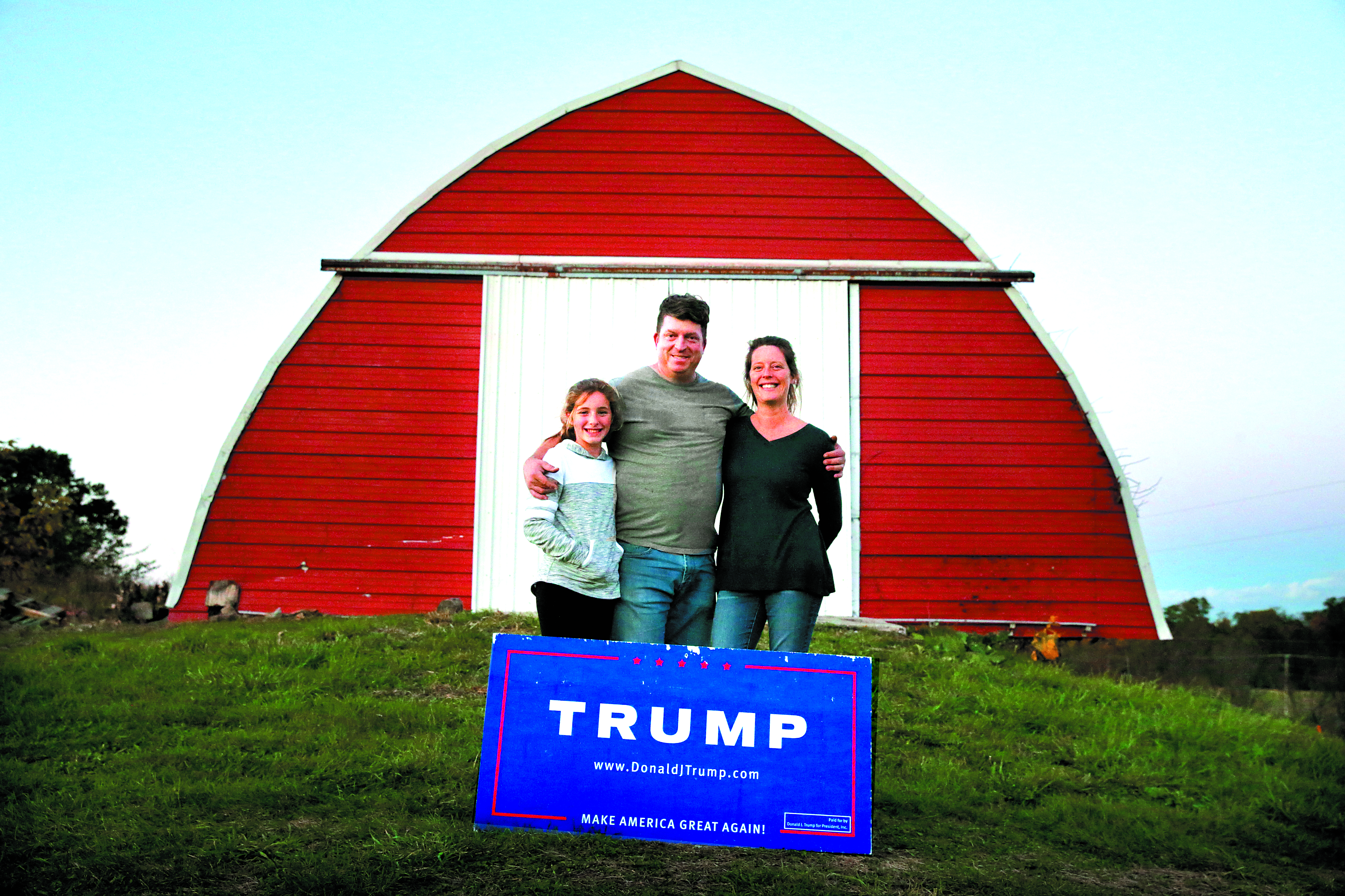 Matt Jansen (center), his wife, Andrea, and their daughter, Maggie, at their family-run farm in New Salem, Pa. Matt won a spot as a Trump delegate at the Republican National Convention.